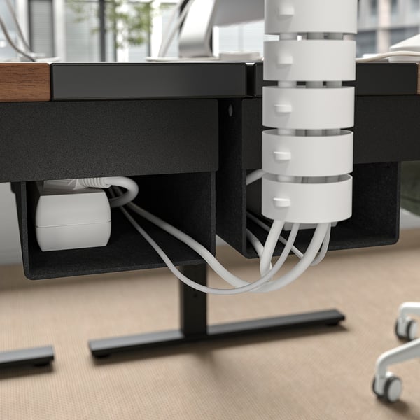 MITTZON desk with cable management tray, showing organised wires and height adjustment feature.