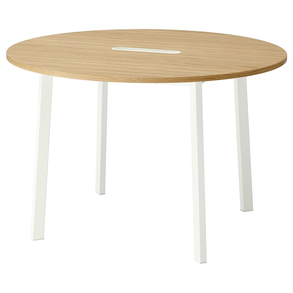 A round, wooden MITTZON office table with white legs, featuring a stain-resistant surface.