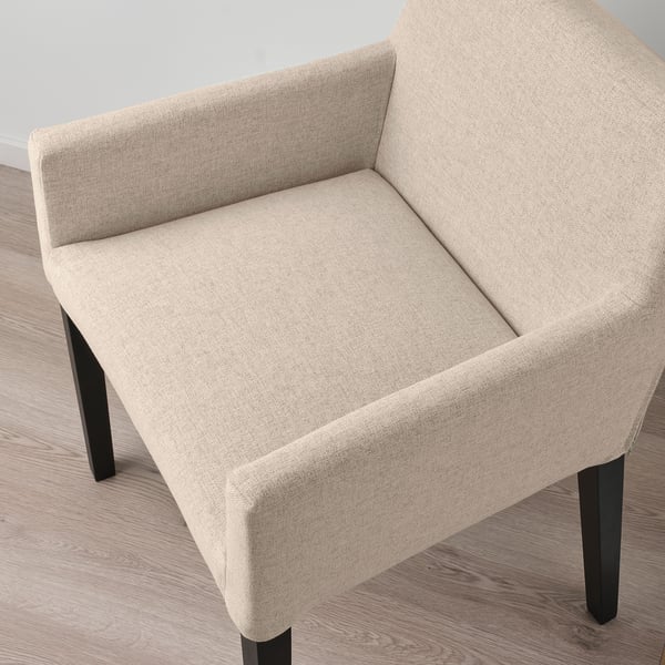 Modern beige upholstered dining chair with sleek black legs, showcasing high-quality fabric and sturdy wooden construction.
