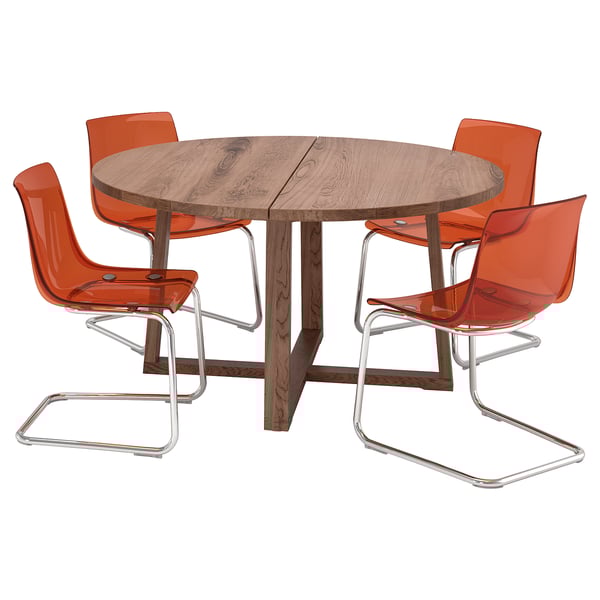 Round MÖRBYLÅNGA dining set with oak table and four orange chairs. Modern, durable design with flexible seating.