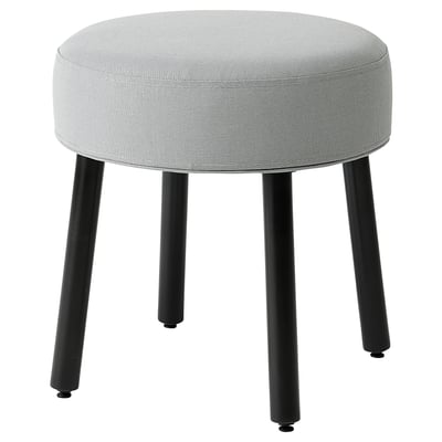 Round, grey fabric stool with black metal legs, stylish and versatile seat.