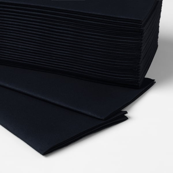 Stack of black paper napkins, neatly folded, looking and feeling like cloth.