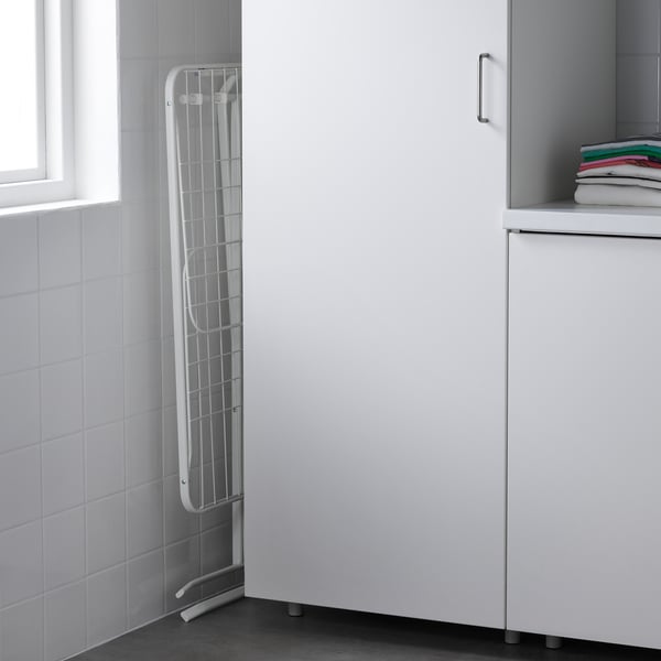 White MULIG foldable drying rack, tall & narrow, fits between cabinet & wall, with two wings & four hooks, indoor/outdoor.
