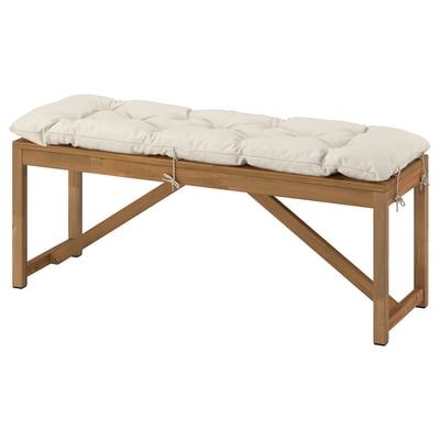 NÄMMARÖ outdoor bench with white cushion, acacia wood, rectangular, simple design.