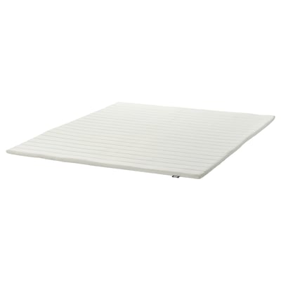 A white NOPAKTE mattress pad; its rectangular, featuring a smooth woven fabric cover.