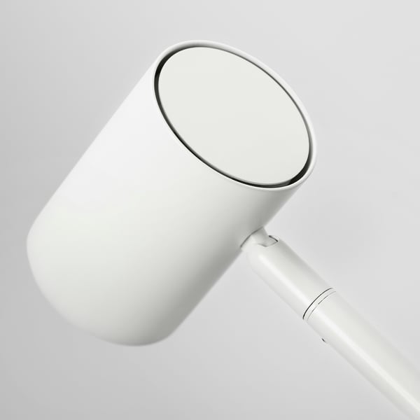 Modern white lamp with adjustable neck, shiny metallic finish.