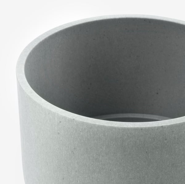 Close-up of NYPON plant pot, shown in grey, smooth texture, made from recycled plastic.