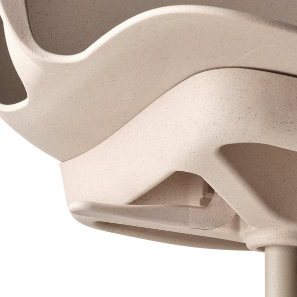 Close-up of ODGER swivel chairs curved, speckled seat and backrest, highlighting smooth, durable material and comfortable design.