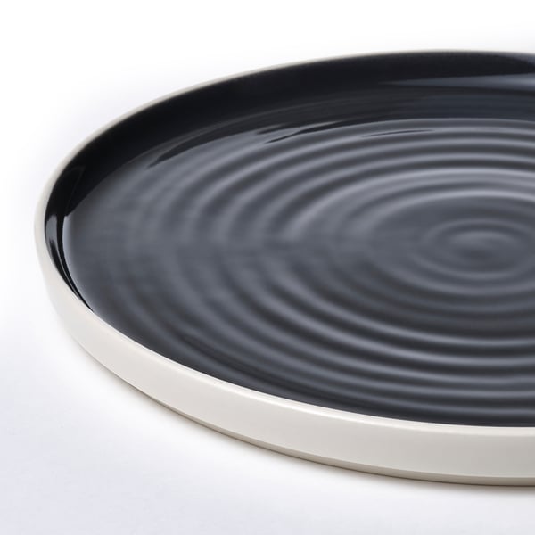 Sleek, modern plate with matte white rim contrasting glossy, dark grey centre, showcasing quality craftsmanship.