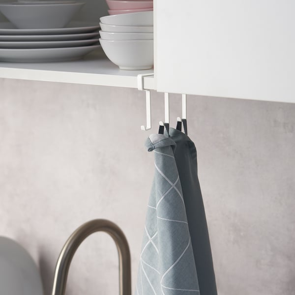 Under-shelf hook rack holding a blue towel, maximising kitchen storage.