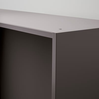 A sleek, modern wardrobe corner in light grey and dark grey, showing smooth, high-quality surfaces and precise joints.