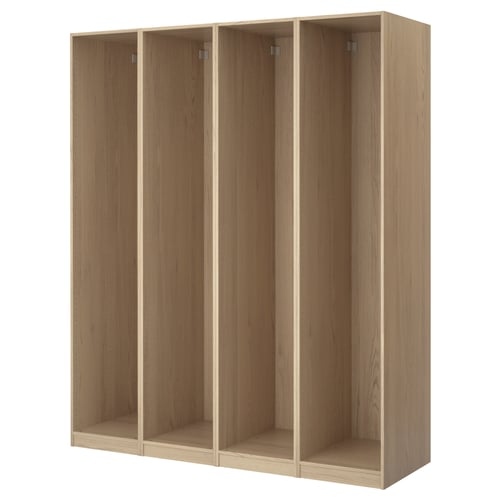 A PAX wardrobe frame in light oak colour, made from particleboard and paper foil, with a rectangular design and four empty sections.