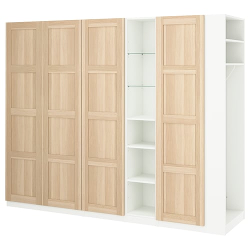 A white and light wood PAX wardrobe with adjustable shelves.