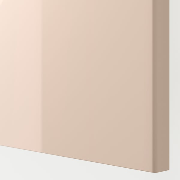 Close-up of sleek, light pink, smooth-finished cabinet.