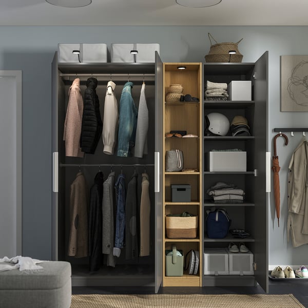 Wardrobe with clothes, shoes, adjustable feet, and internal lighting.