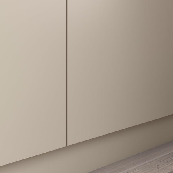 This image shows a section of a beige, modern wardrobe with minimalist design and light-colored interior.