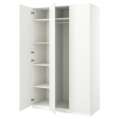White ikea PAX wardrobe, open doors, empty shelves.