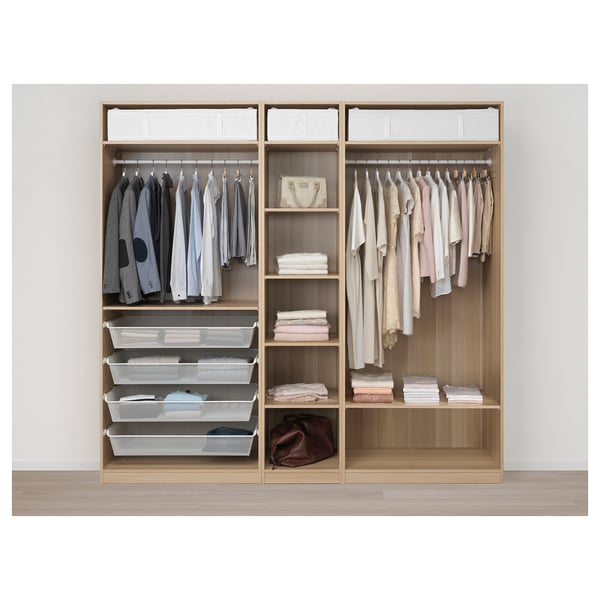 Wooden wardrobe with clothes, shelves, and mesh baskets for folded items.