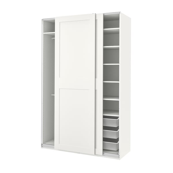 An off-white ikea PAX wardrobe with sliding doors and internal shelves & drawers for storage.