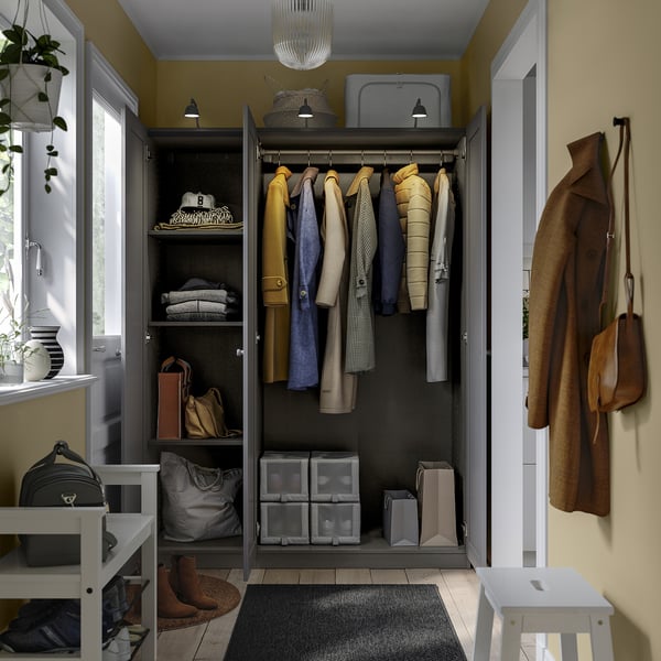 Closet with clothes hangers, shelves, and storage boxes. Adjustable feet, slow-closing hinges, and wall mounting.