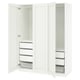 A white ikea PAX wardrobe with open doors. It shelves and drawers in a minimalist design.