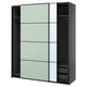 Modern black PAX wardrobe with sliding mirrored doors, mesh baskets, and adjustable shelves.