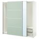 An ikea PAX white wardrobe with glass doors and mesh drawers.