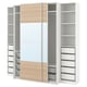 White & wooden ikea PAX wardrobe with open, adjustable shelves and mesh drawers.