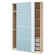 Open light blue PAX wardrobe with wooden shelves and sliding doors.
