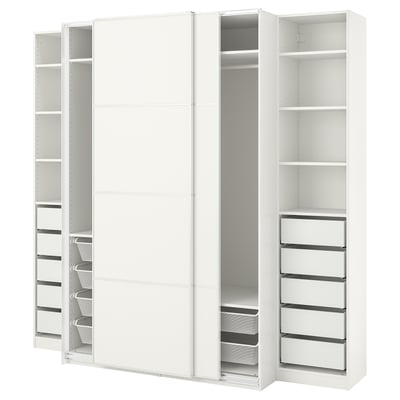 A white PAX wardrobe with sliding doors and multiple shelves, drawers, and storage bins. Its designed for organised storage with sleek, modern lines.