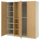 An open light wood-colored PAX wardrobe with shelves and hanging space. Its made of particleboard and has a modern minimalist design.