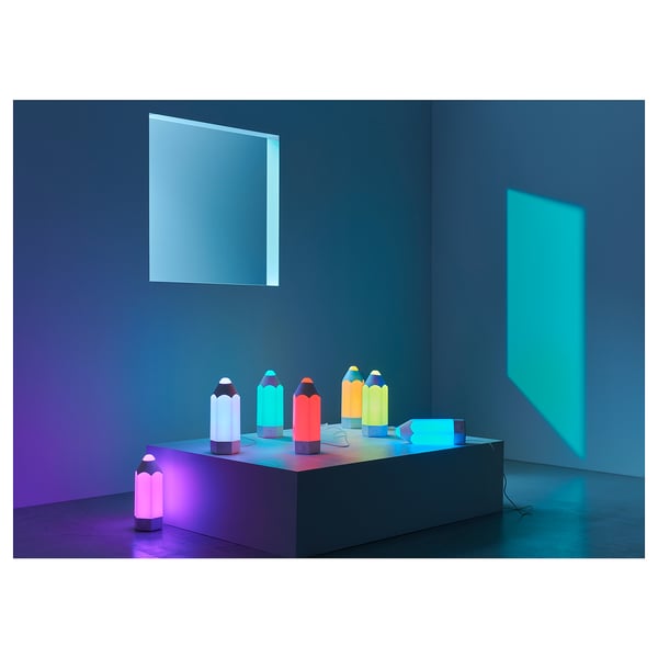 Colourful led lamps on grey table, modern design, various colours, safe material.