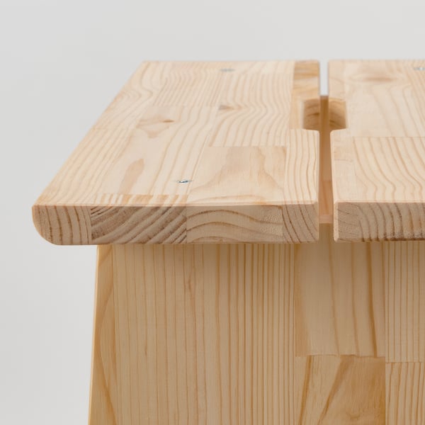A sturdy wooden stool with smooth edges and visible grain, showcasing high-quality craftsmanship.
