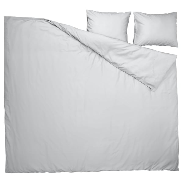 White duvet set displayed, including cover and pillowcases, smooth material, rectangular shape.
