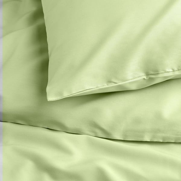 Smooth green bed sheet set with pillows, high quality, soft texture, visible button closure.