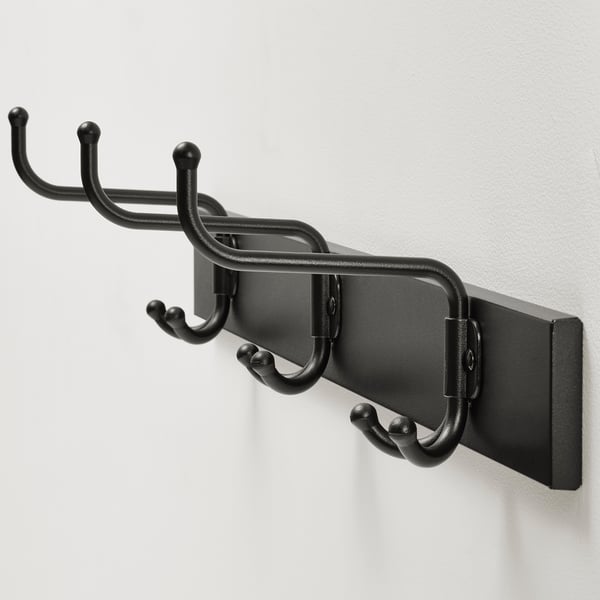 Black wall-mounted coat rack with three hooks; sleek and sturdy design.