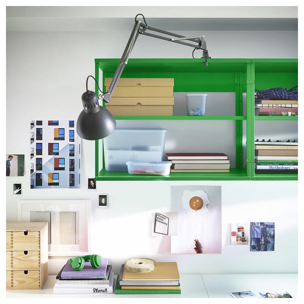 Green PLATSA shelf unit with lamp, books, and decor.