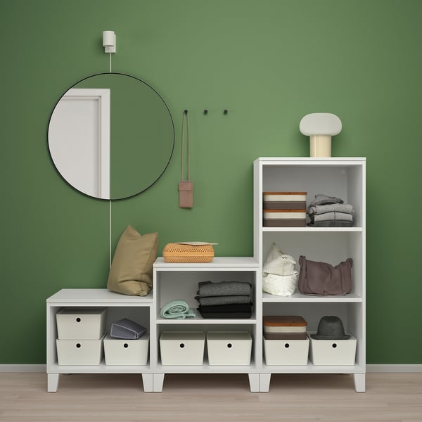 Modern PLATSA storage, green wall, neat clothes, mirror.