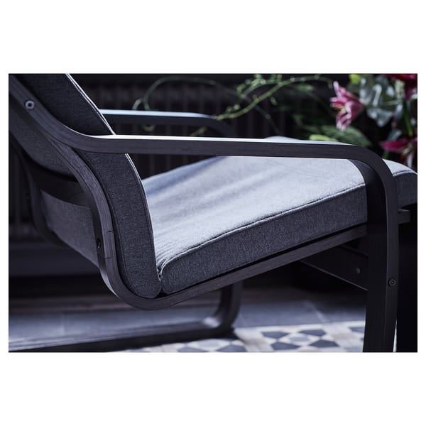Modern black wooden chair with grey cushion. Comfortable and sleek design.