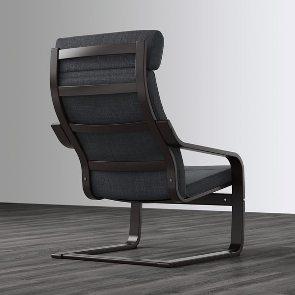 Black POÄNG armchair with curved lines and high back for neck support, on grey floor.