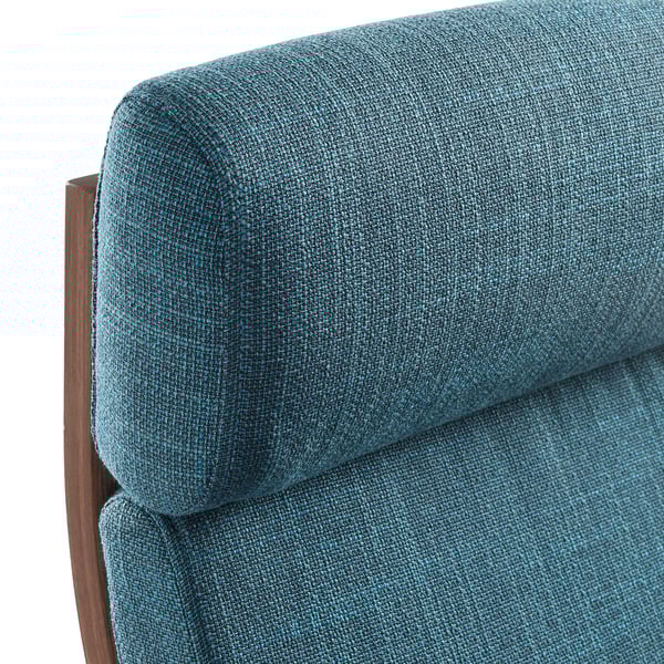 Close-up of a teal fabric-covered cushioned chair corner, showcasing its high-quality, textured weave and supportive wooden frame.