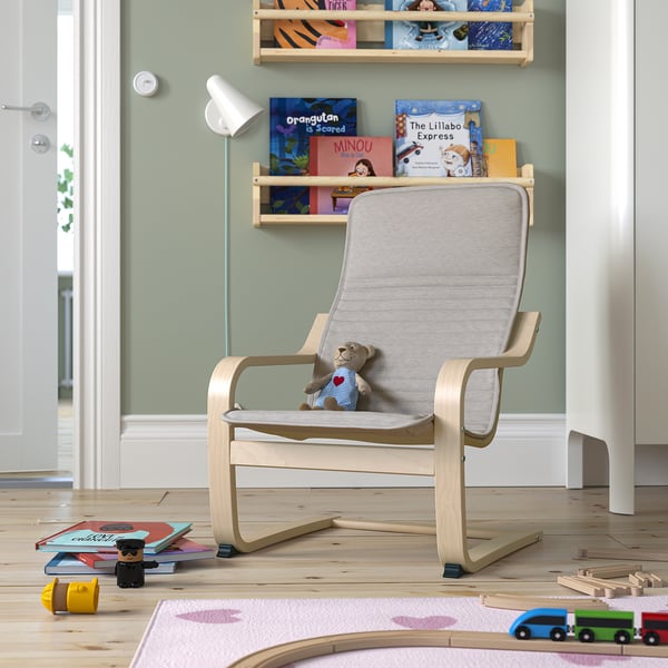 Childrens POÄNG chair, light wood, grey cushion, toys, books, cosy corner