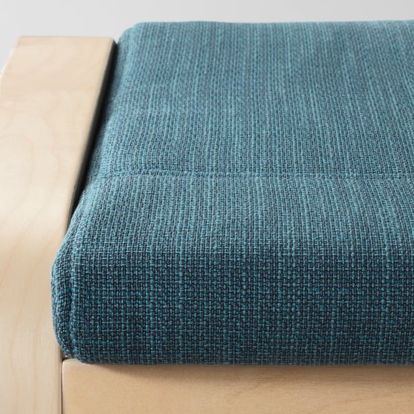 Close-up of POÄNG footstool showcasing its high-quality teal cushion and sturdy wooden frame.