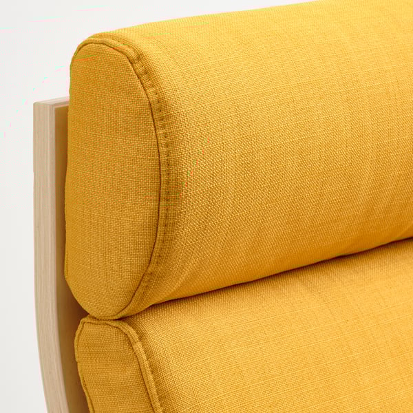 Mustard yellow cushioned seat and backrest of a relaxing armchair, showing soft and supportive texture