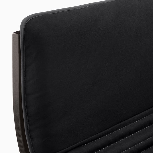 Black upholstered chair with smooth, curved edges. High back and seat cushioning, showing detailed stitching.
