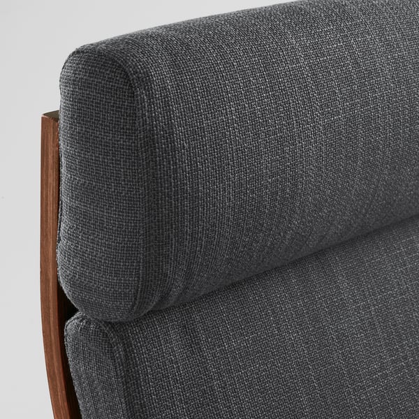 Comfy grey upholstered chair armrest close-up, showing soft texture and wooden frame detail.