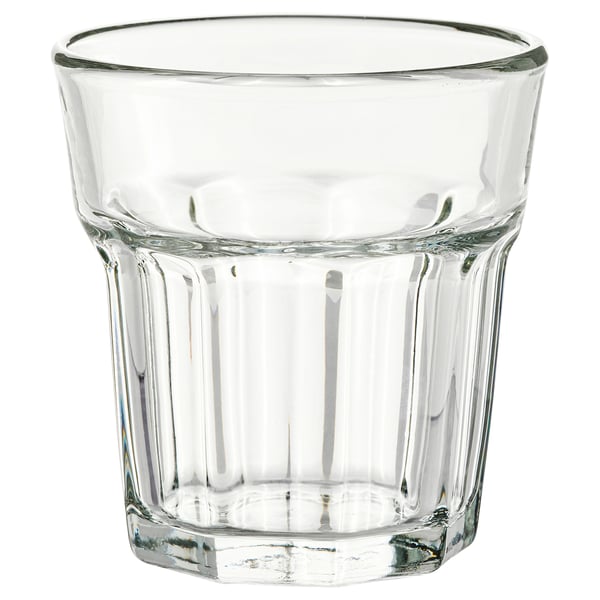 A POKAL brand tempered glass tumbler. Its clear, cylindrical with ridged sides, and designed for various beverages.
