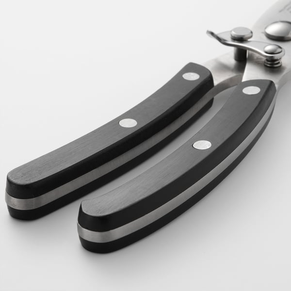 Metal shears with black plastic handles, stainless steel parts, designed for durability and safety.
