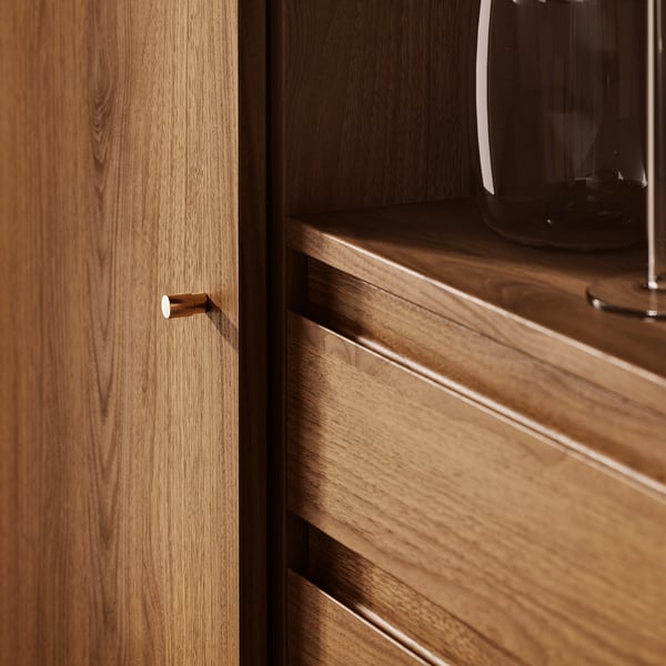 Wooden cabinet with warm walnut finish, featuring sleek handles, and black metal legs. Highlights quality craftsmanship and mid-century design.