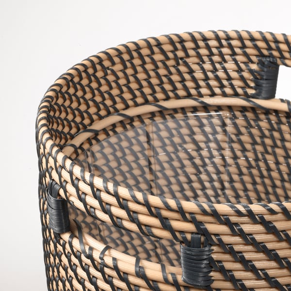 Woven basket with handles, showcasing intricate black and beige pattern; crafted for durability and style.